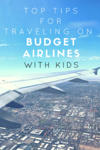 Tips on flying on budget airlines with kids. #familytravel #budgetairlines #wowair #ryanair #spiritairlines #cheaptickets #cheapflights